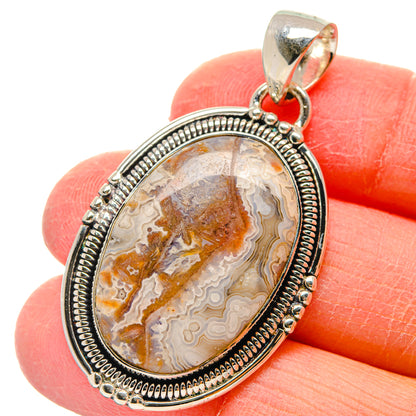Oval lace agate pendant in 925 sterling silver with textured bezel and bail