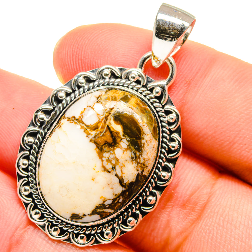 Sterling silver oval jasper pendant with ornate border and tan-brown stone, top bail.