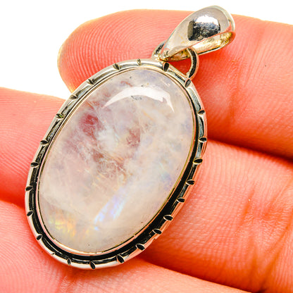 Oval rainbow moonstone pendant with iridescent white and pink tones, 925 silver bail