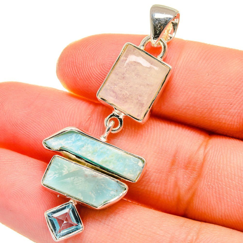 Sterling silver gemstone pendant close-up with rose moonstone, turquoise bars, and blue topaz