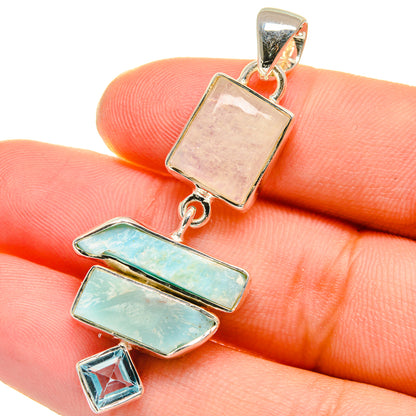 Sterling silver gemstone pendant close-up with rose moonstone, turquoise bars, and blue topaz