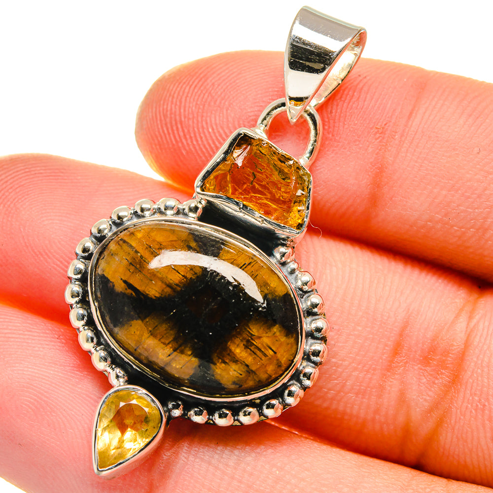 925 sterling silver pendant with oval chiastolite cabochon and two teardrop citrine stones