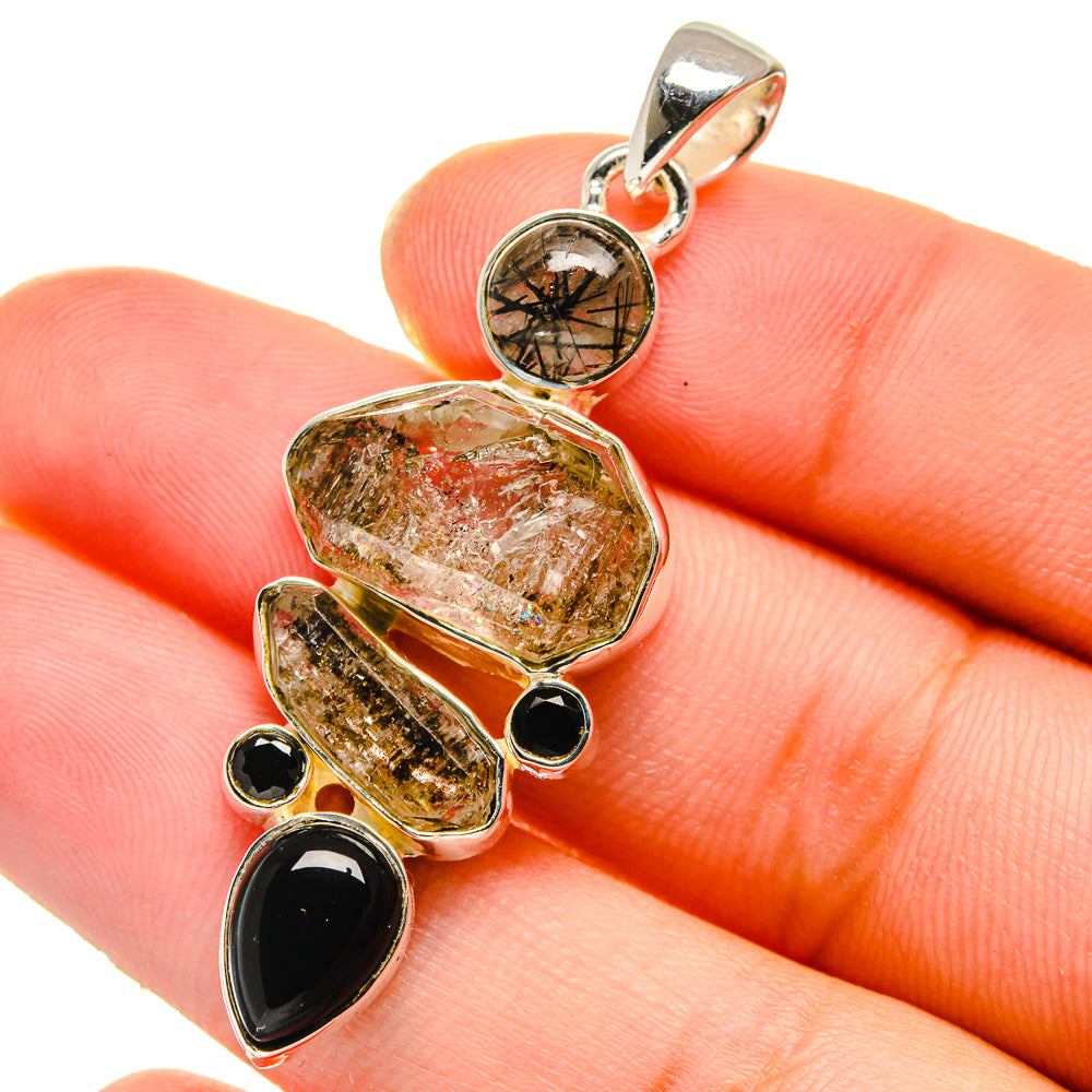 Sterling silver pendant charm with rutilated quartz teardrops, black onyx ovals, round center