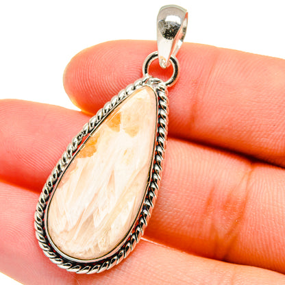 Sterling silver teardrop pendant with peach-white scolecite, rope setting and bail
