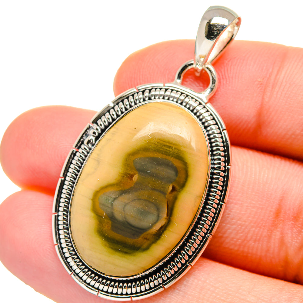 Oval yellow-green jasper pendant in sterling silver bezel with beaded edge