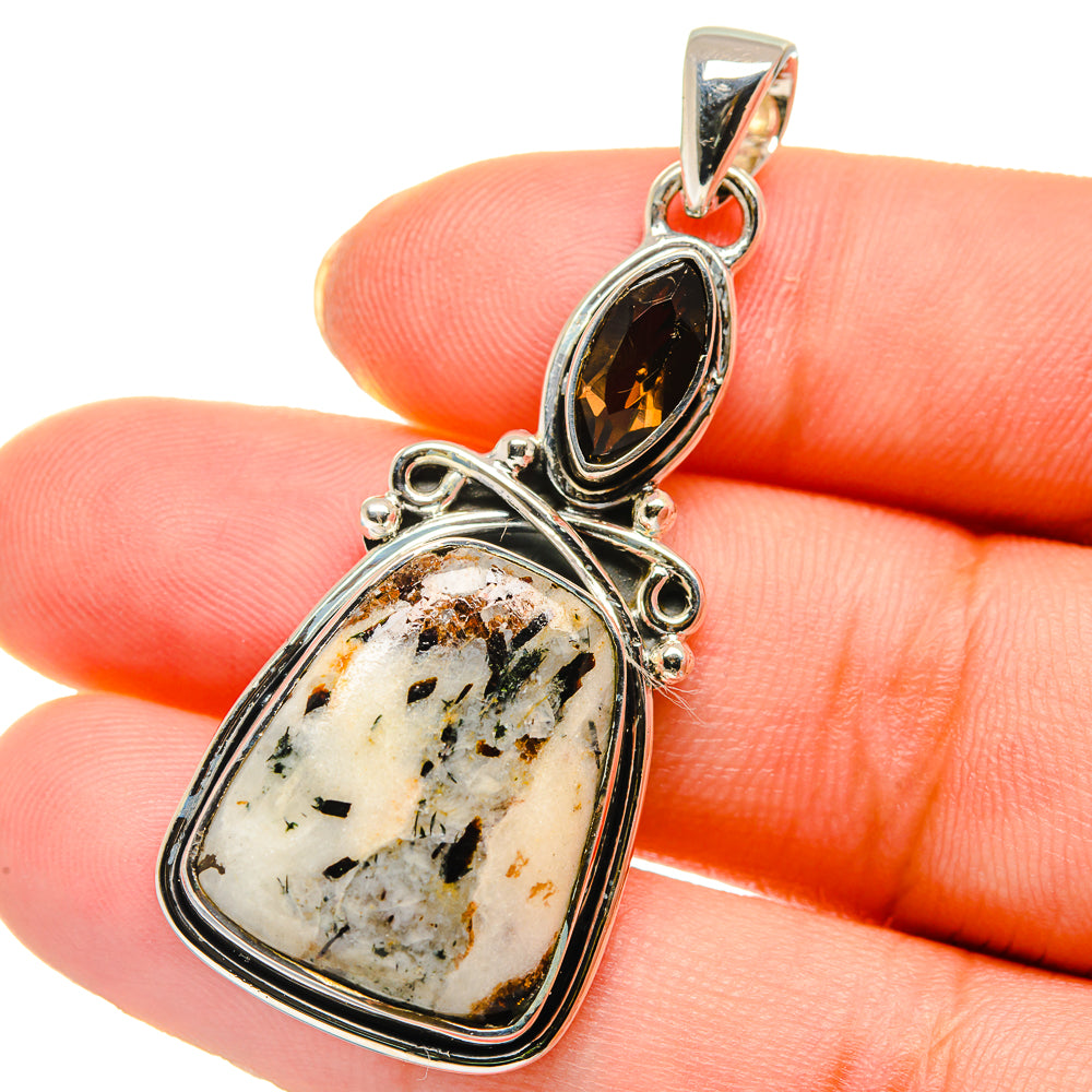 Sterling silver two-stone pendant with dark oval smoky quartz and pale speckled cabochon