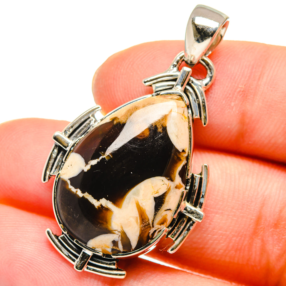 Teardrop jasper pendant with silver bezel, prong settings, and hanging loop