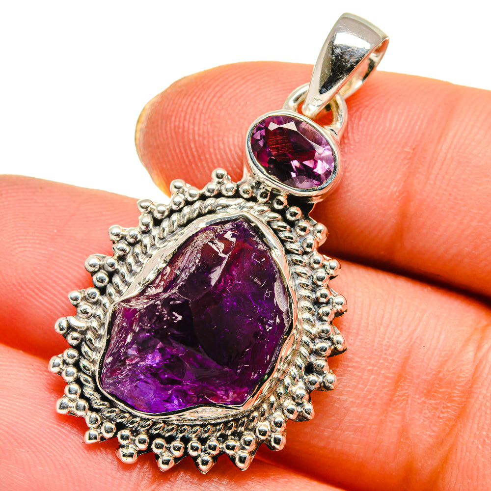 925 sterling silver rough amethyst pendant with two purple stones in ornate bezel setting.