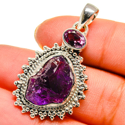 925 sterling silver rough amethyst pendant with two purple stones in ornate bezel setting.