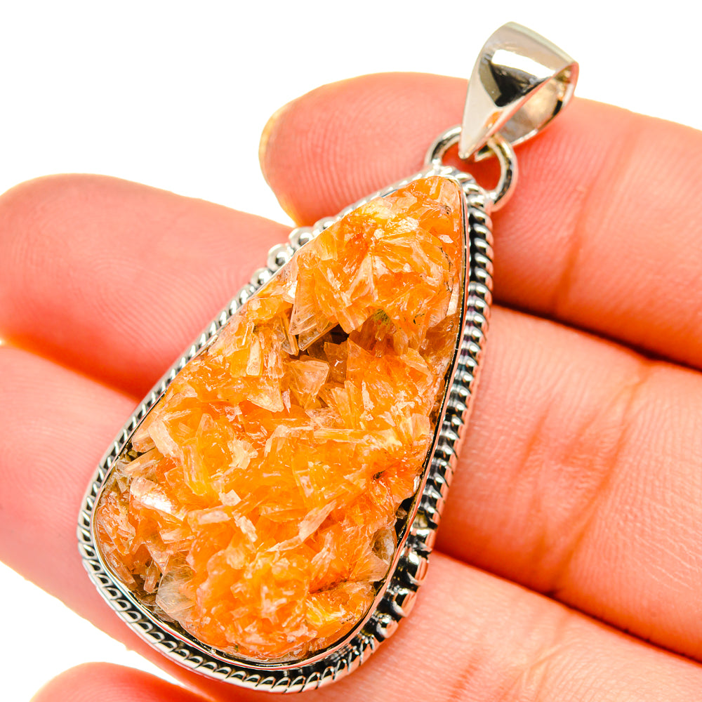 Orange calcite crystal teardrop pendant in 925 sterling silver bezel with bail