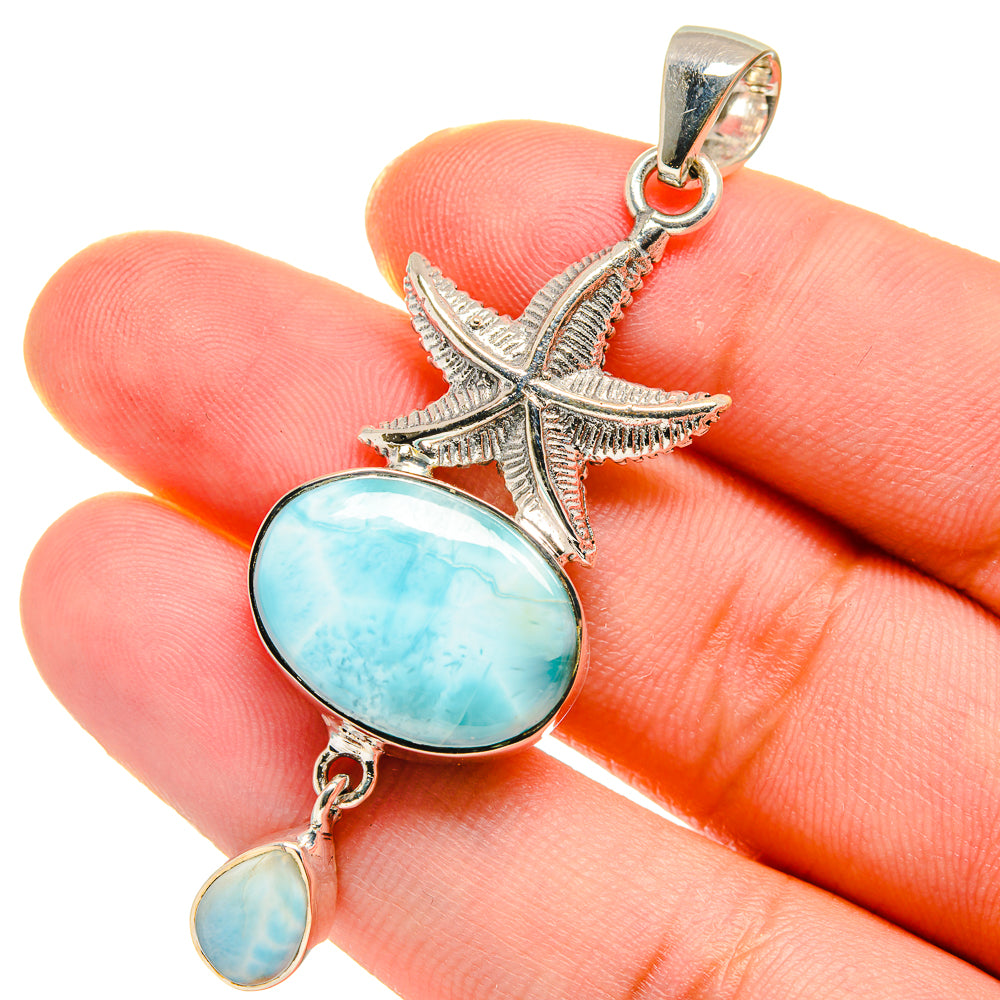 Sterling silver starfish pendant with oval larimar cabochon and small dangling stone