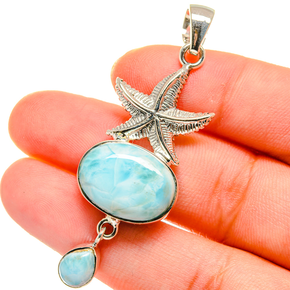 Larimar starfish pendant in 925 sterling silver, close-up of blue cabochon drops