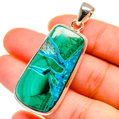 Rectangular teal-green and blue gemstone pendant on fingers, polished 925 silver bail