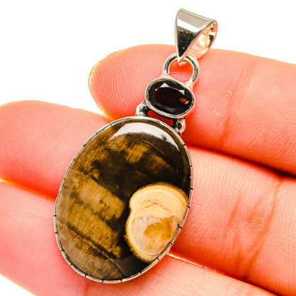 Brown striped oval stone pendant in sterling silver with dark oval top charm