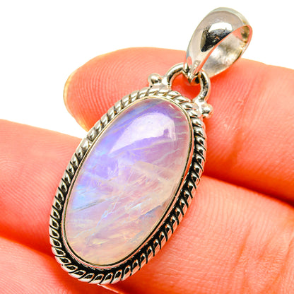 Iridescent rainbow moonstone pendant, oval purple-blue stone in silver bezel