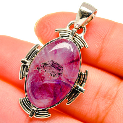 Oval amethyst pendant in 925 sterling silver with magenta cabochon stone and bail
