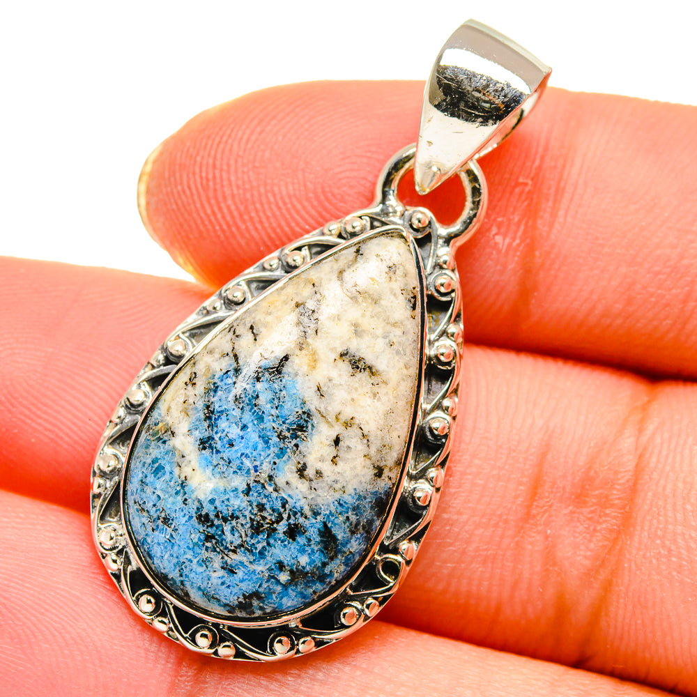 Sterling silver teardrop pendant with blue azurite gemstone cabochon, ornate bezel