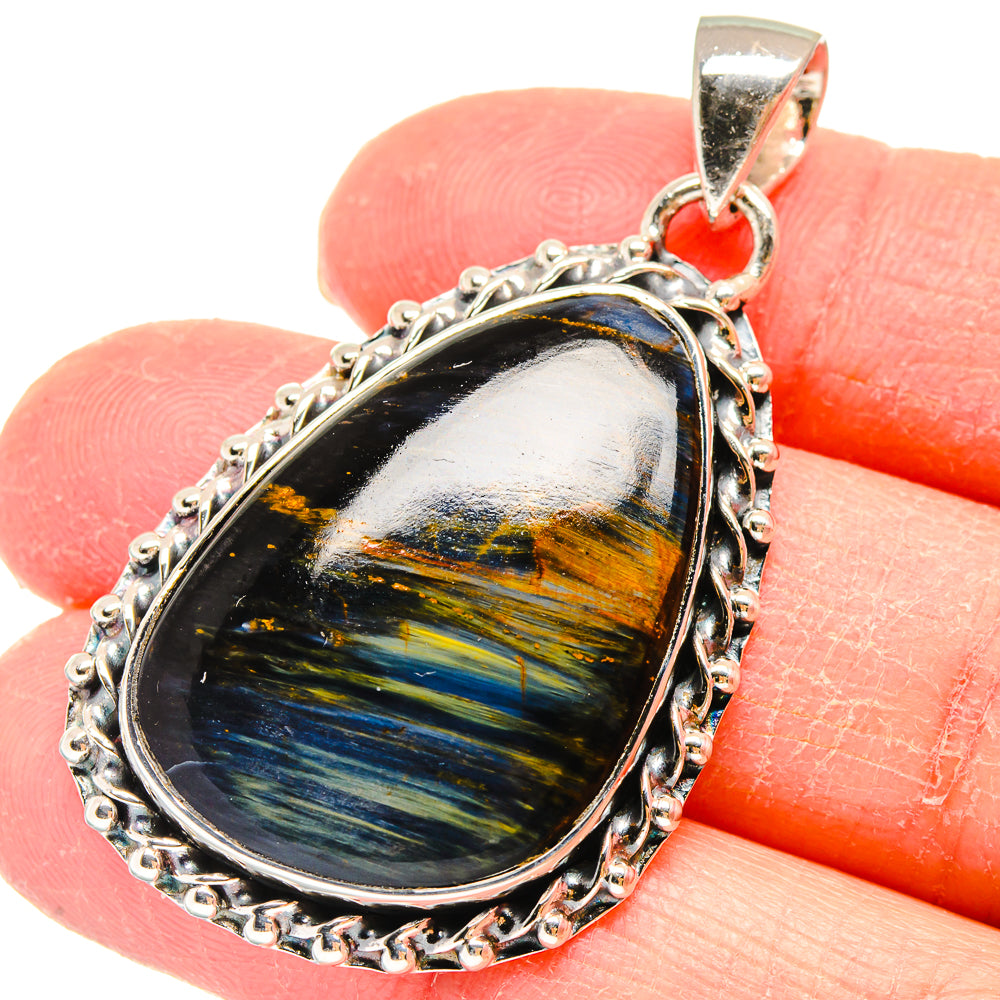 Oval pietersite pendant in sterling silver setting with textured rope bezel and bail