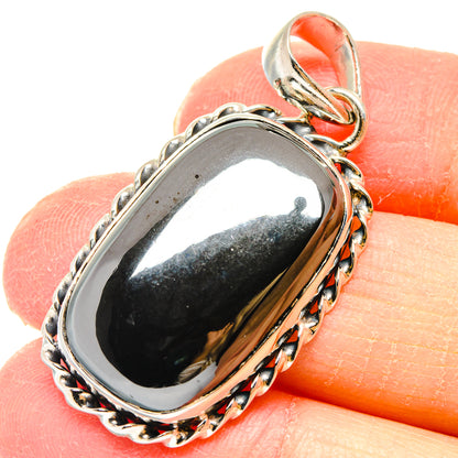 Hematite pendant in 925 sterling silver with oval dark stone bezel and bail
