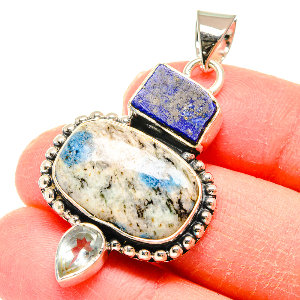 Sterling silver pendant with oval white quartz, blue lapis rectangle, and teardrop accents