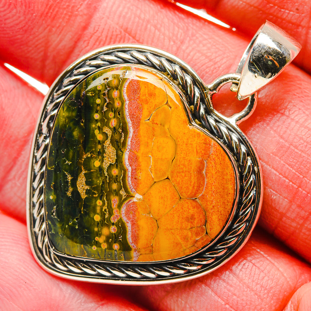 Heart-shaped ocean jasper pendant in silver, orange and green stone with rope edge