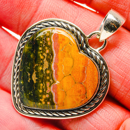Heart-shaped ocean jasper pendant in silver, orange and green stone with rope edge