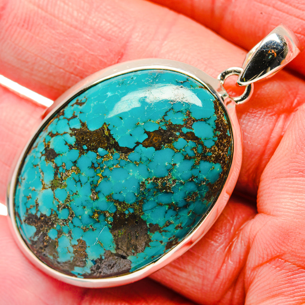 Turquoise oval pendant with mottled stone pattern, 925 sterling silver frame