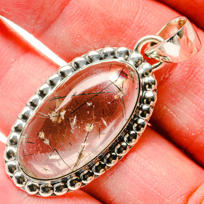 Oval tourmalinated quartz pendant in beaded 925 silver bezel with loop bail, red stone