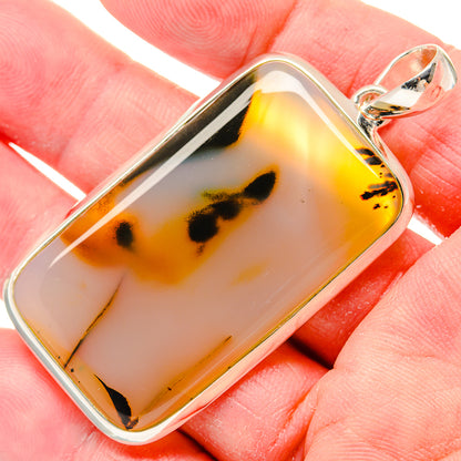 Montana agate pendant in sterling silver bezel, amber and black mottled stone
