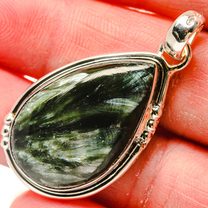 Seraphinite pendant in sterling silver, teardrop green stone with polished bezel.