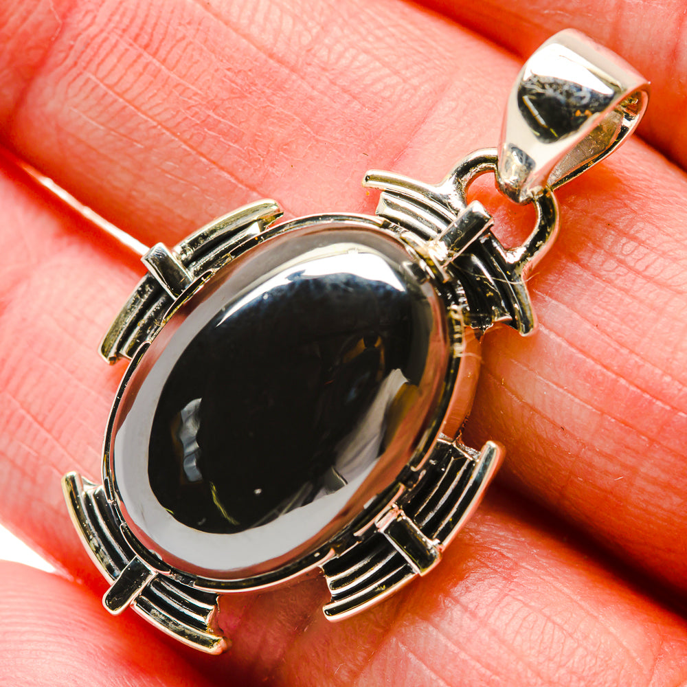 925 sterling silver pendant with oval black gemstone and metal bar accents