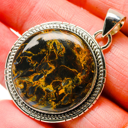 Oval pietersite pendant in 925 sterling silver bezel with textured rope border