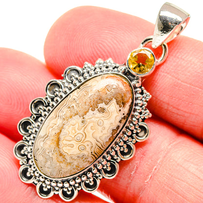 Oval lace agate pendant with citrine gemstone in sterling silver filigree setting