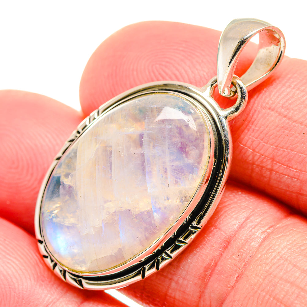 Sterling silver moonstone pendant with oval rainbow opal cabochon and bail
