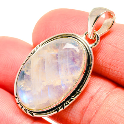 Sterling silver moonstone pendant with oval rainbow opal cabochon and bail