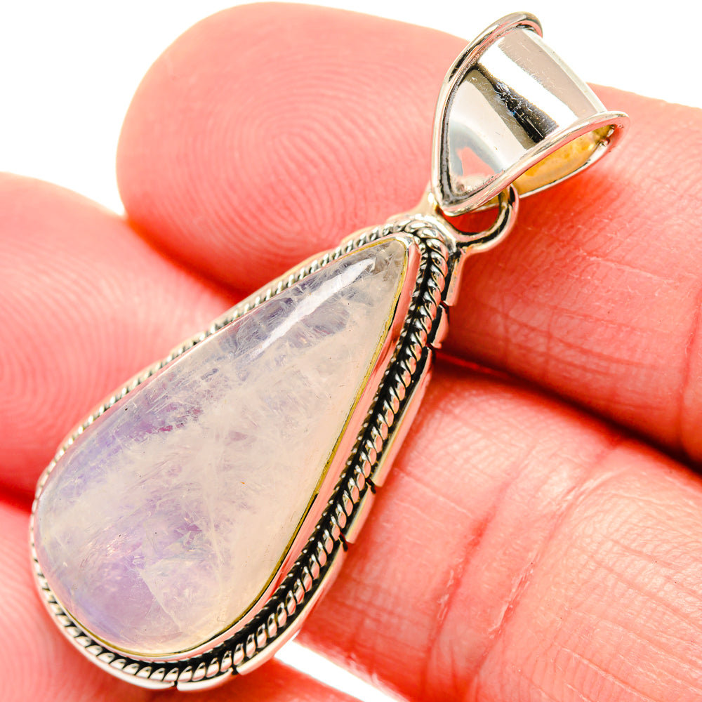 Teardrop moonstone pendant close-up, silver rope-edge setting with prong bail