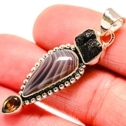 925 sterling silver pendant with black tektite and smoky quartz in beaded oval frame