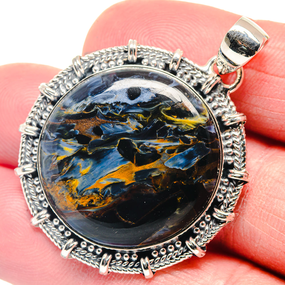 Round pietersite cabochon pendant with ornate 925 sterling silver frame and top loop bail.