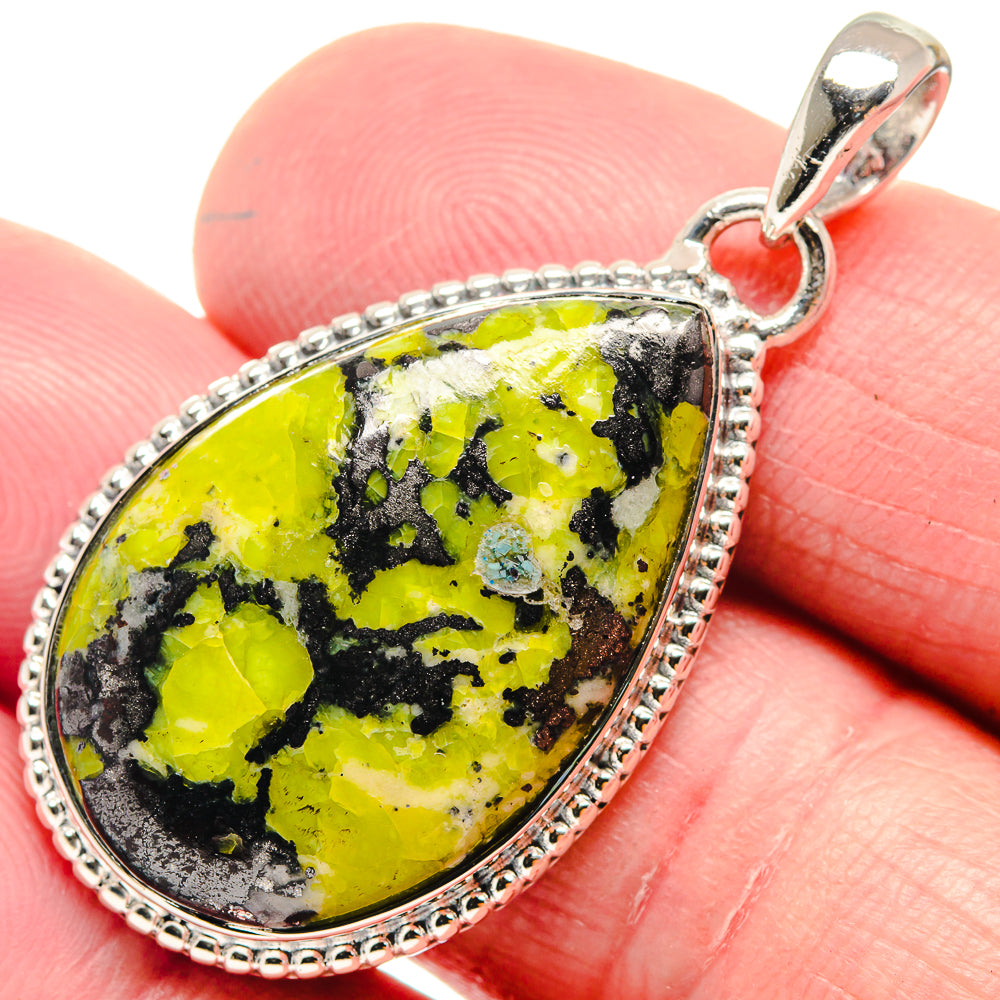 Teardrop green opal pendant in 925 sterling silver bezel with textured border and loop bail