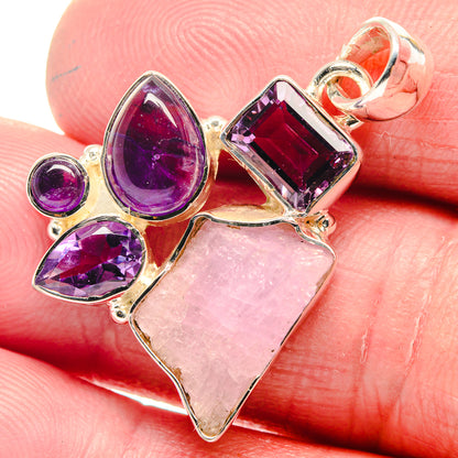 Sterling silver pendant close-up with rough rose quartz heart and purple amethyst marquise stones