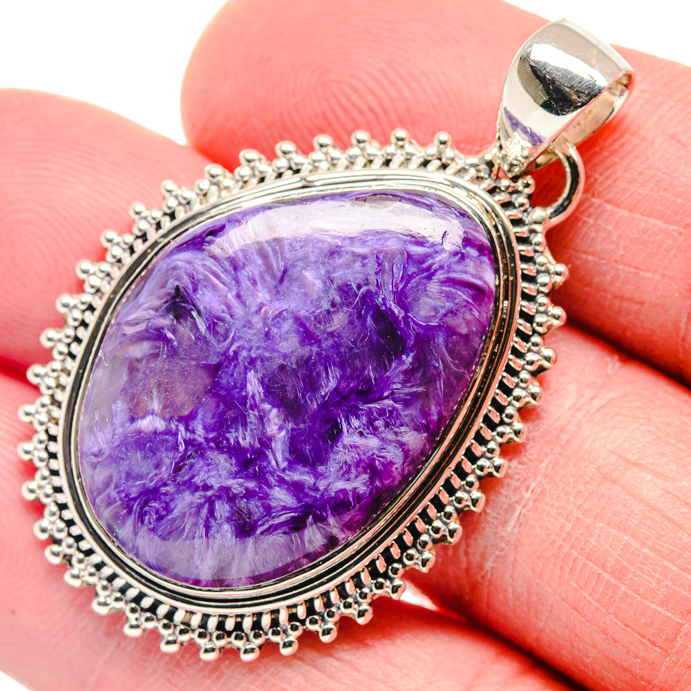 Sterling silver charoite pendant, oval purple cabochon with textured edge and bail