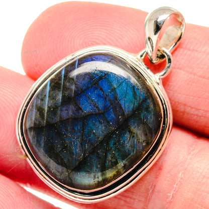 Labradorite pendant in 925 sterling silver with round blue gemstone bezel setting