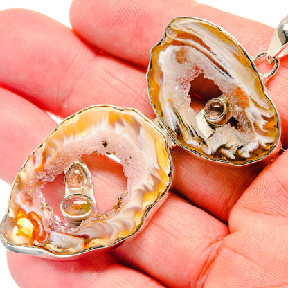 Sterling silver citrine geode pendant close-up, teardrop crystal slice with bail