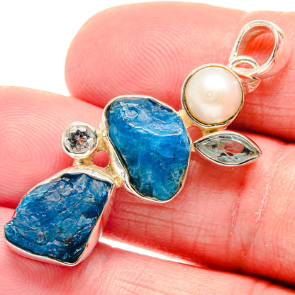 Rough blue stone pendant with cultured pearl and clear-blue marquise detail, silver setting