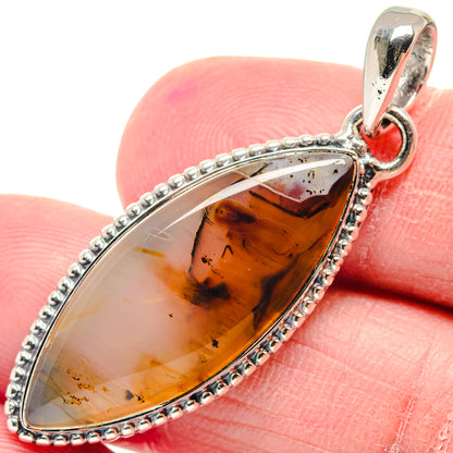 Teardrop amber agate pendant with silver beaded border and loop bail.
