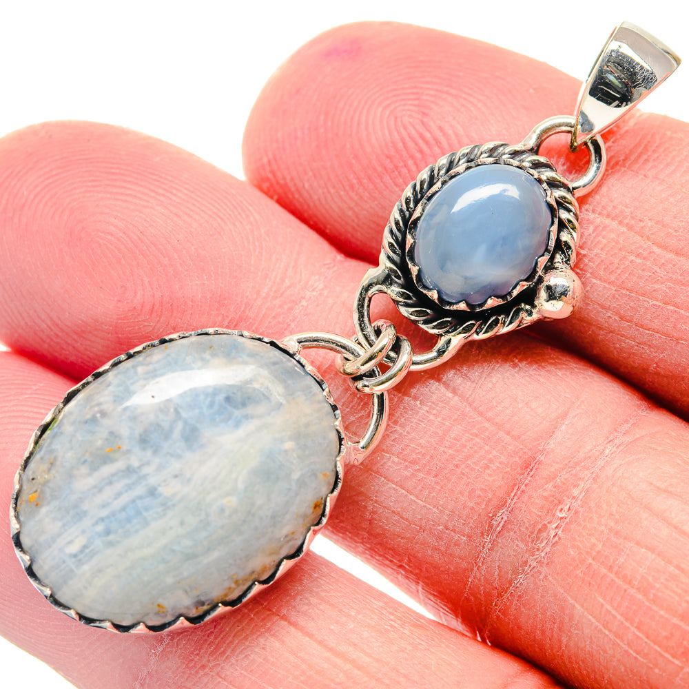 Sterling silver double oval opal pendant with blue stone and ornate bezel setting