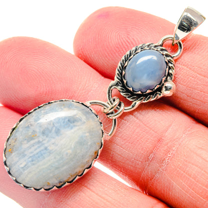 Sterling silver double oval opal pendant with blue stone and ornate bezel setting