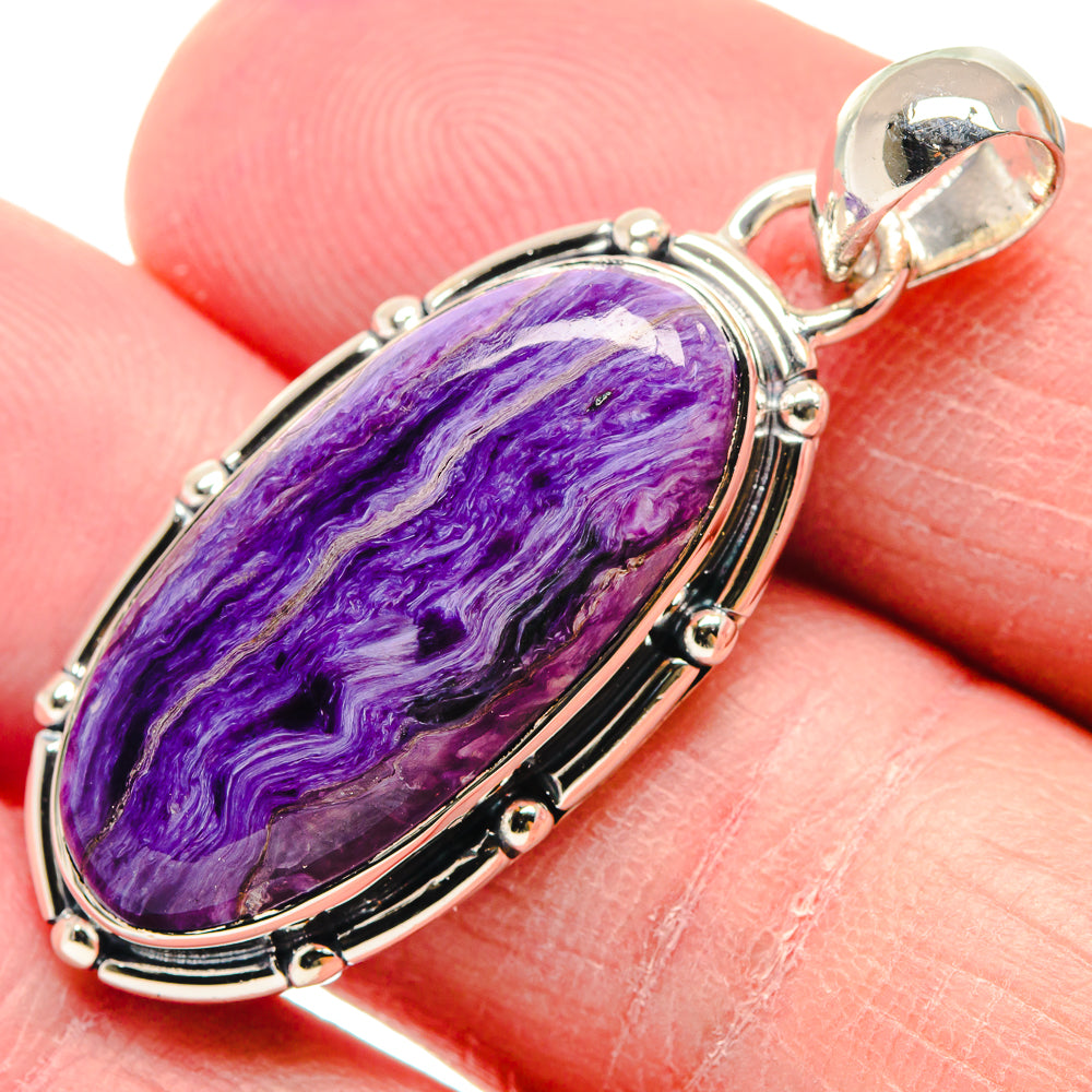 Oval purple charoite cabochon pendant in 925 sterling silver with bead-set bezel