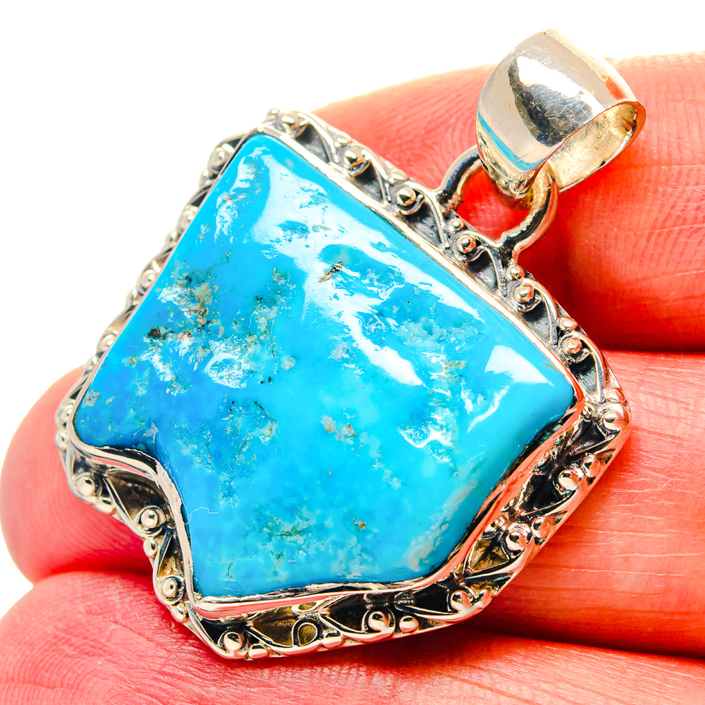 Sterling silver chrysocolla pendant with bright blue teardrop stone and ornate frame