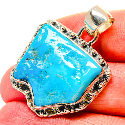 Sterling silver chrysocolla pendant with bright blue teardrop stone and ornate frame
